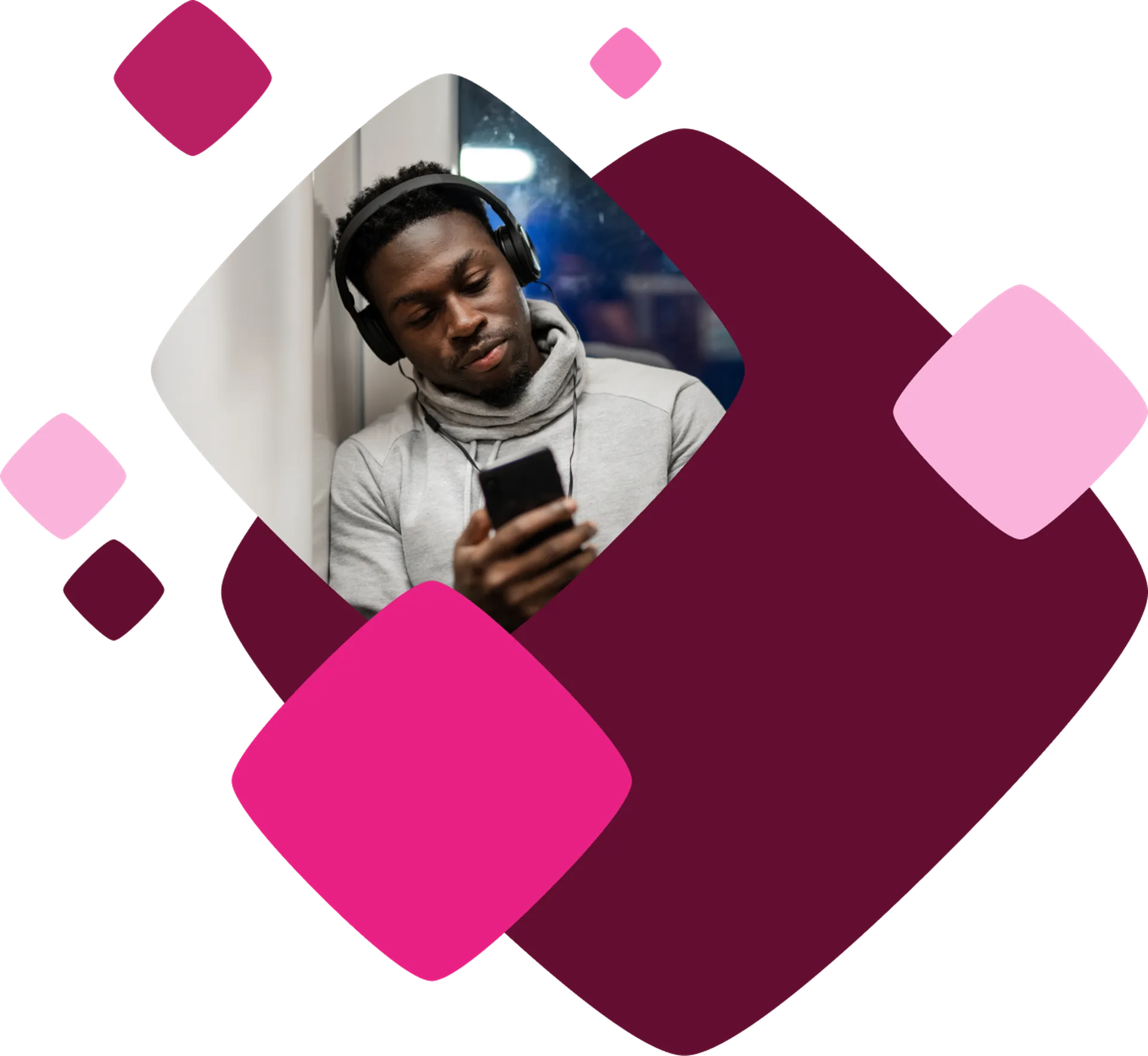 Man with headphones on, looking at a smartphone, against a geometric background of overlapping maroon and pink shapes.